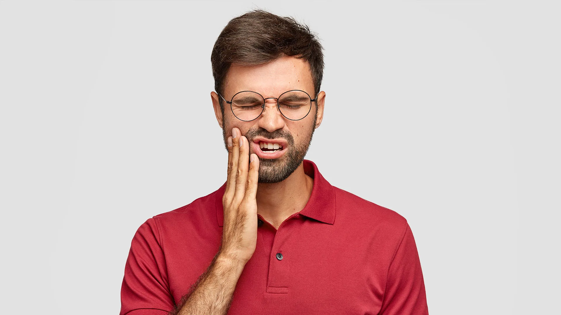 Patient experiencing dental pain — Caring Dental of Herndon emergency care